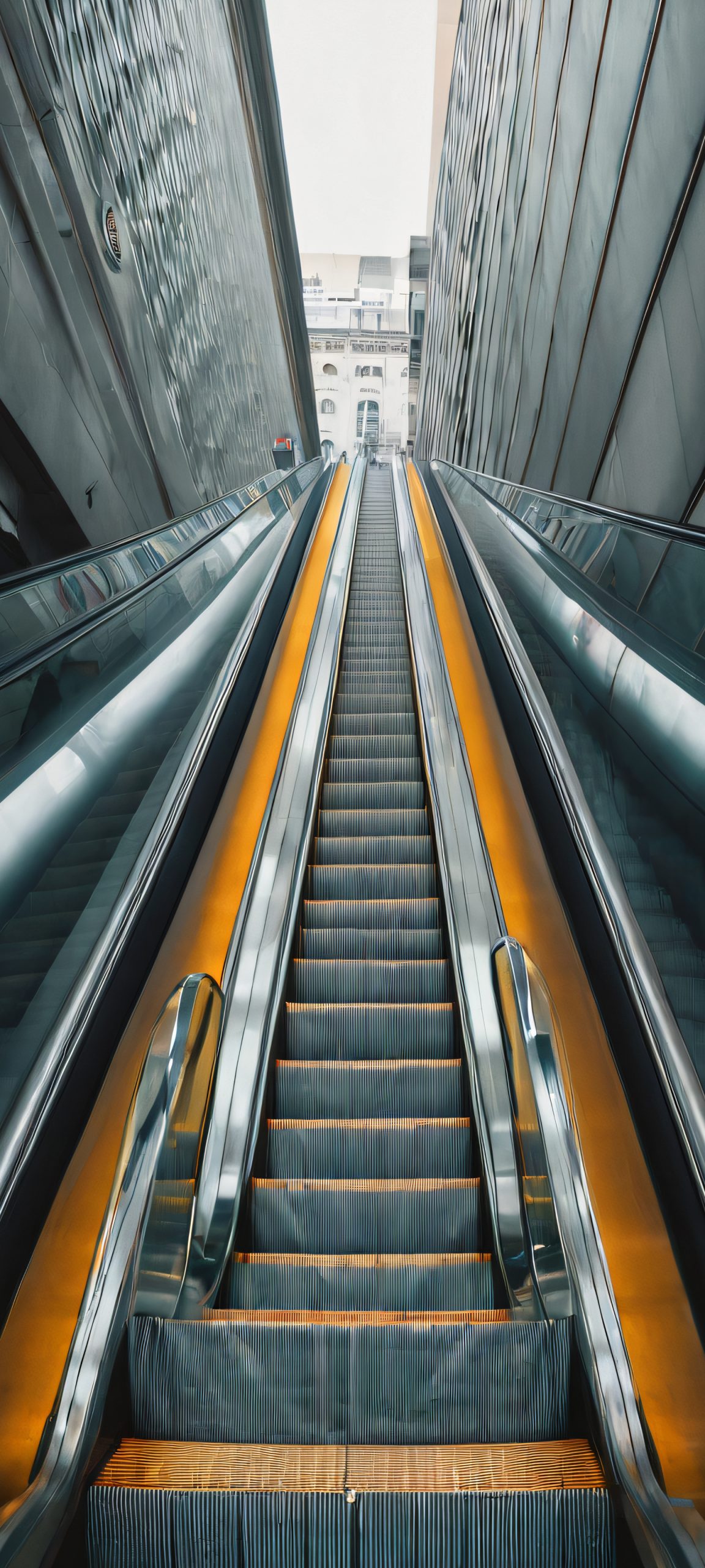 Citylife Ascending 2K QHD Home Screen A moody cityscape with an escalator rising into the darkness, perfect for iPhone/Android home screens.