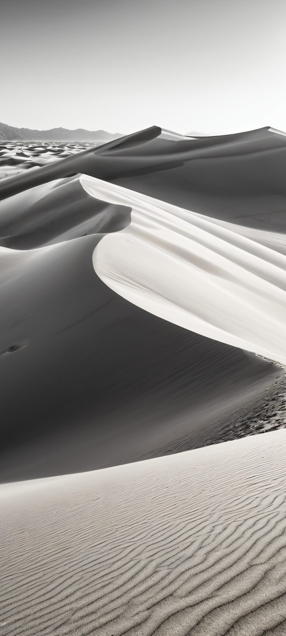 iPhone/Android wallpaper: A stunning vertical image of sand dunes against a high-contrast black and white sky.