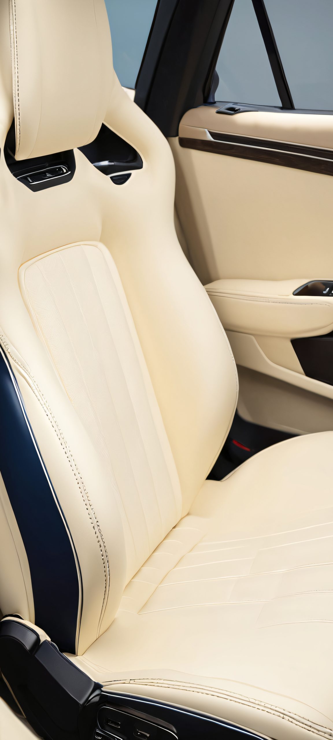 Luxury Car Interior 2K Phone Wallpaper Beautiful iPhone and Android mobile phone wallpaper of a luxurious car interior, featuring soft blue and cream colors, perfect for your home screen