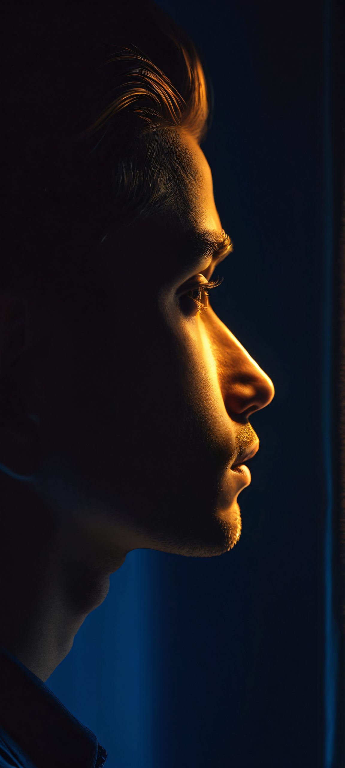 Midnight Serenade Lock Screen for iOS & Android Person standing in darkness, lit only by warm golden light, suitable for iPhone/Android home screens.