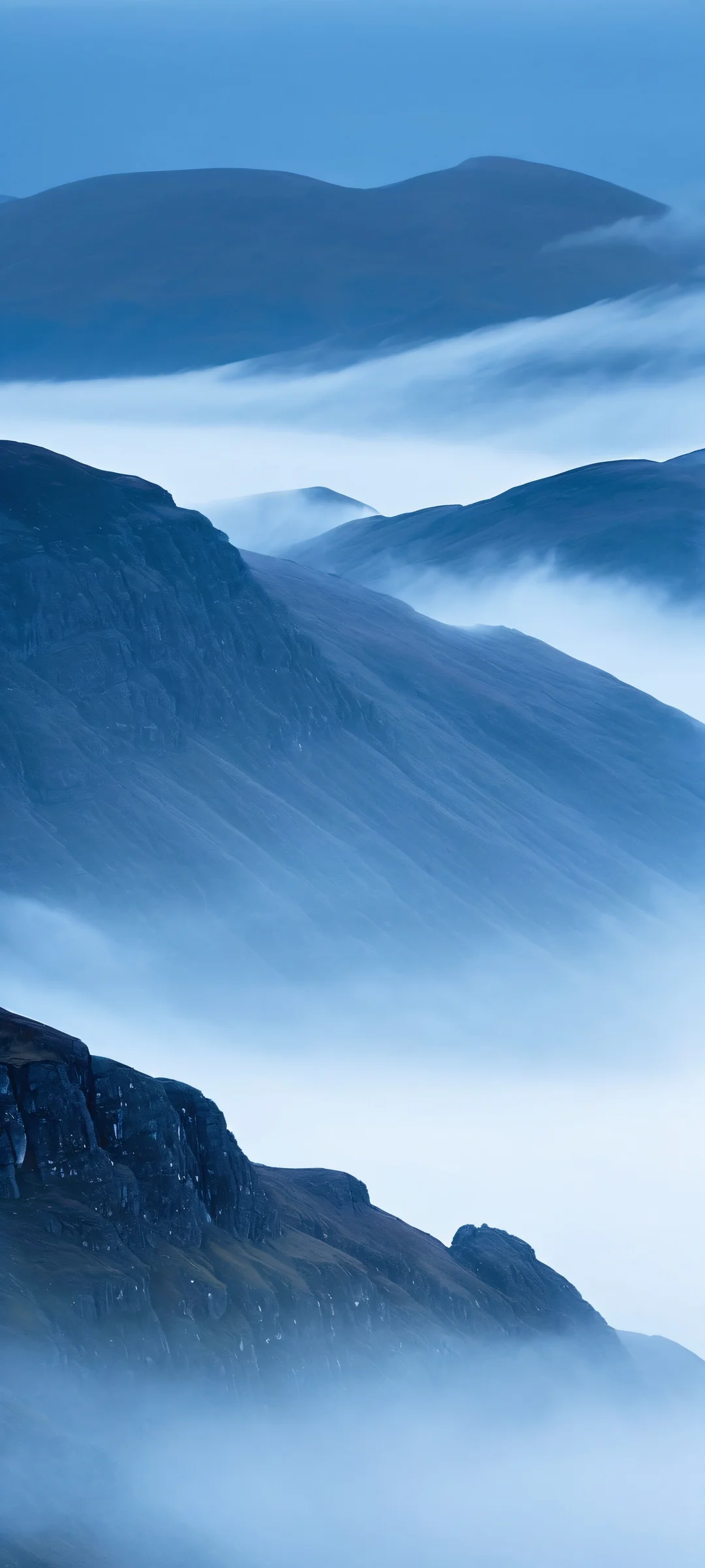 Moonlit Highlands 2K QHD Mobile Wallpaper iPhone and Android users will love this breathtaking vertical mobile phone wallpaper of the foggy Scottish Highlands at night, captured in stunning Fancha Style V.5.