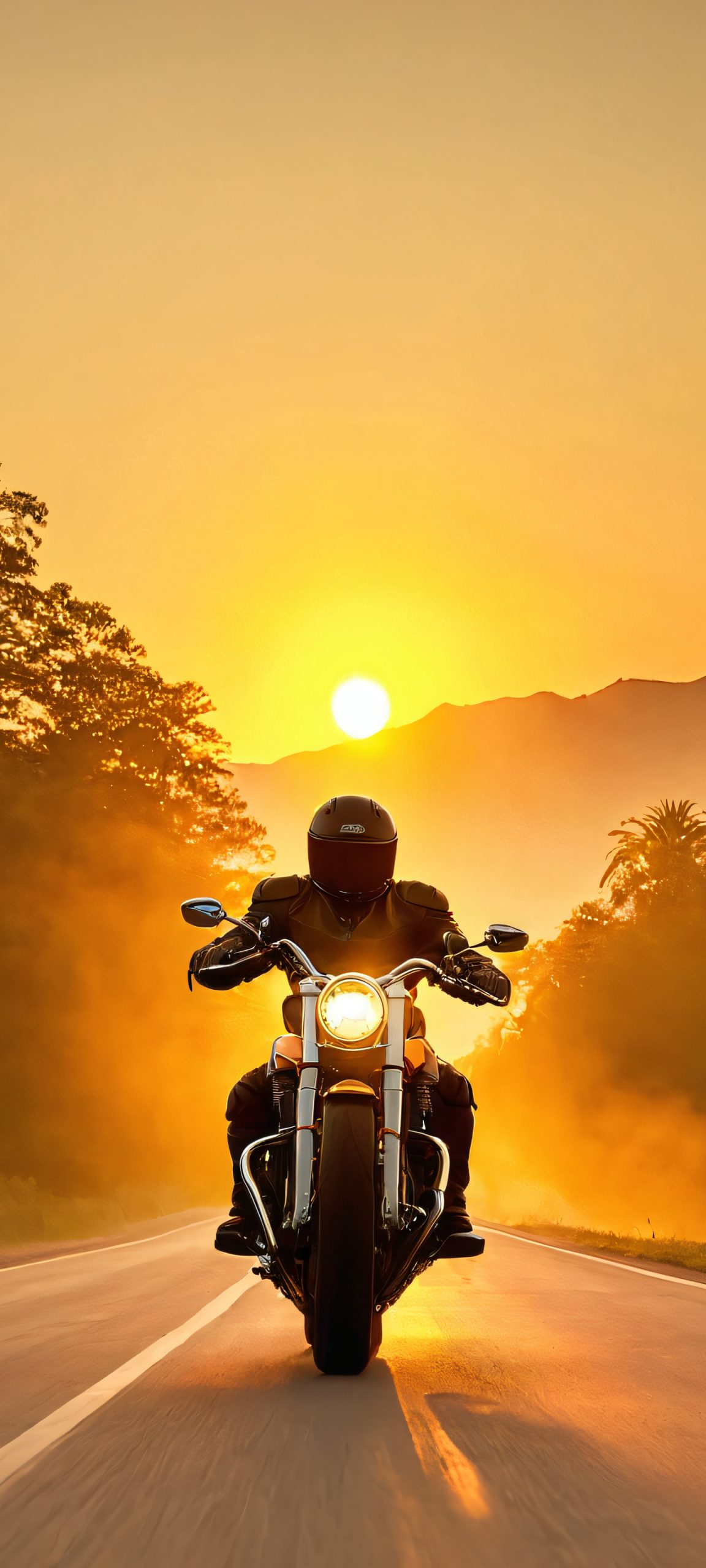 Motorcycle Rider on the Open Road 2K Mobile Background iPhone and Android users, get ready to be awestruck by this stunning vertical mobile wallpaper of a motorcycle rider on the open road, perfectly capturing the beauty of golden hour