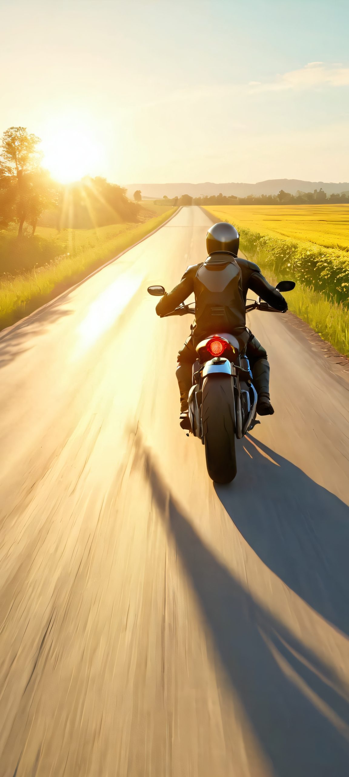 Motorcycle rider on a rural road, perfectly optimized for iPhone, Samsung Galaxy, and Android home screens.