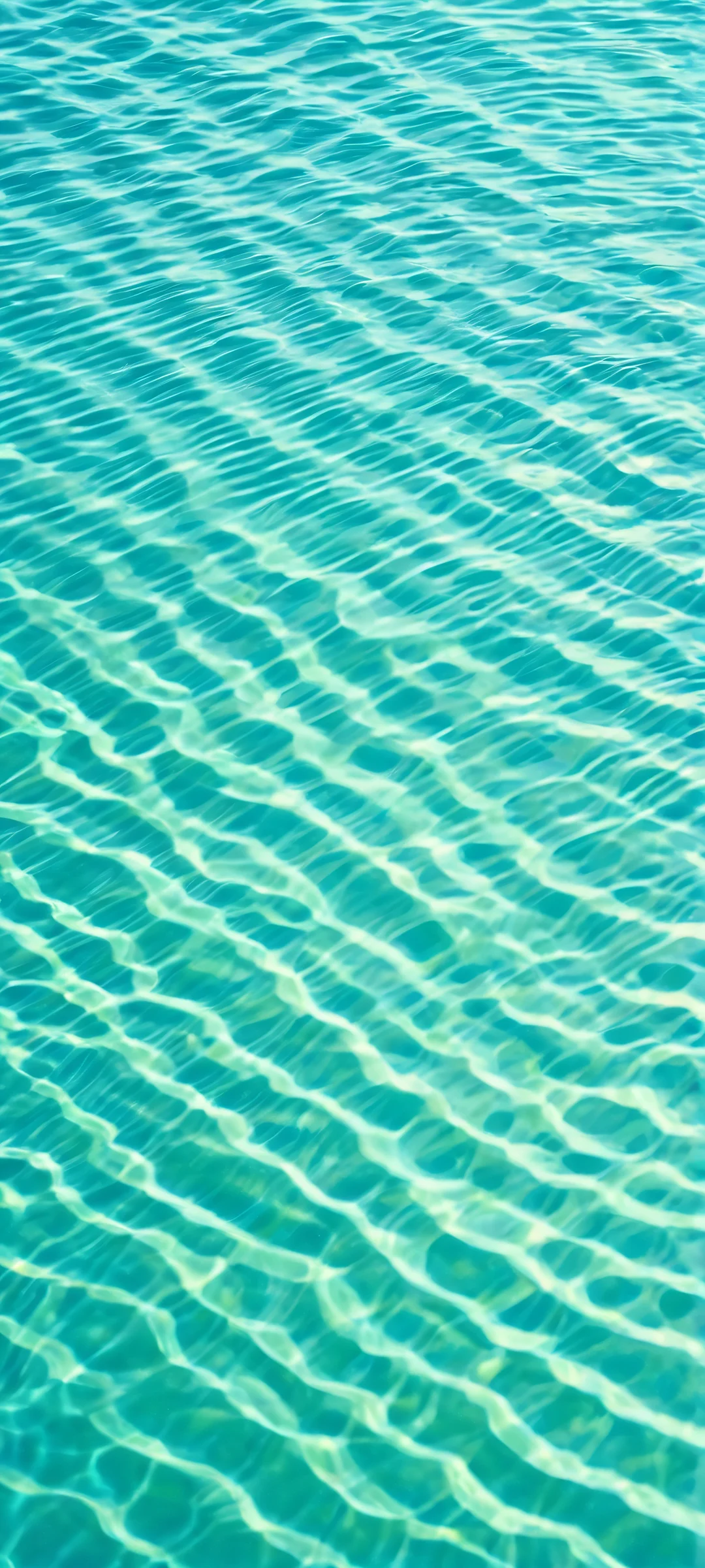 iPhone and Android users, immerse yourself in the mesmerizing abstract oceanic ripples on this stunning blue-green wallpaper.