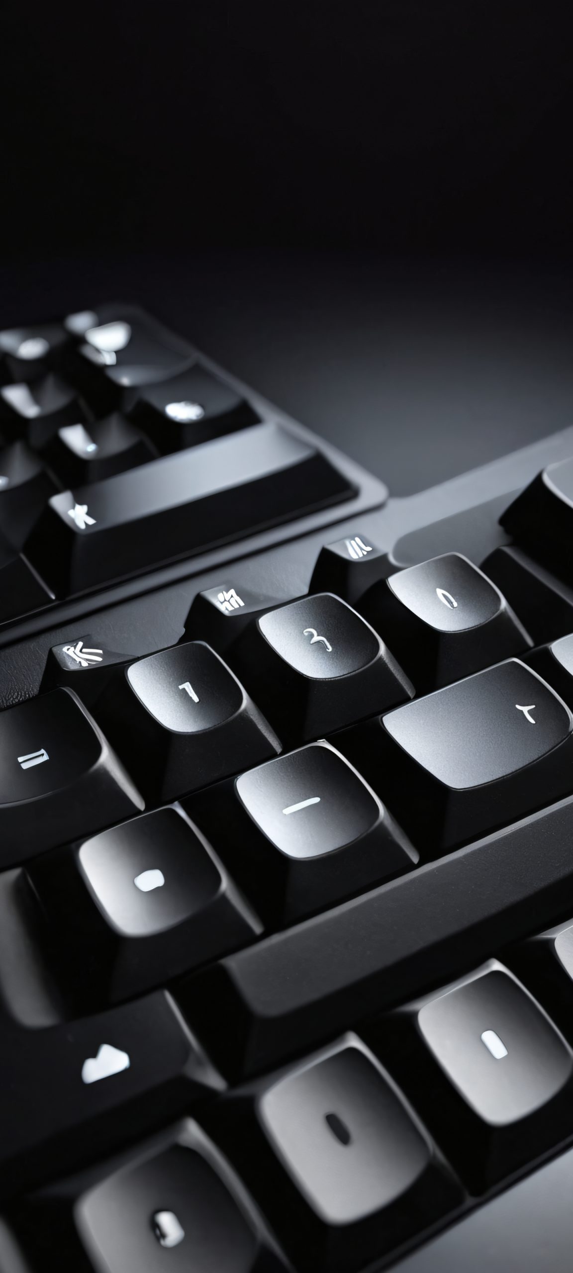 A stunning image of a computer keyboard in a dark room, perfectly optimized for iPhone and Android devices.