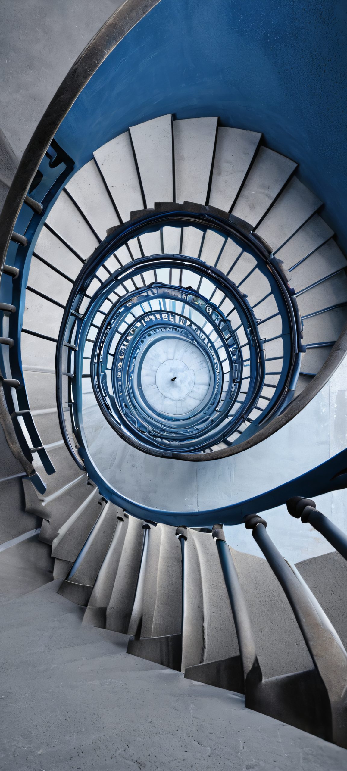 Spiral staircase in a dimly lit indoor space, perfect for iPhone/Android home screens.