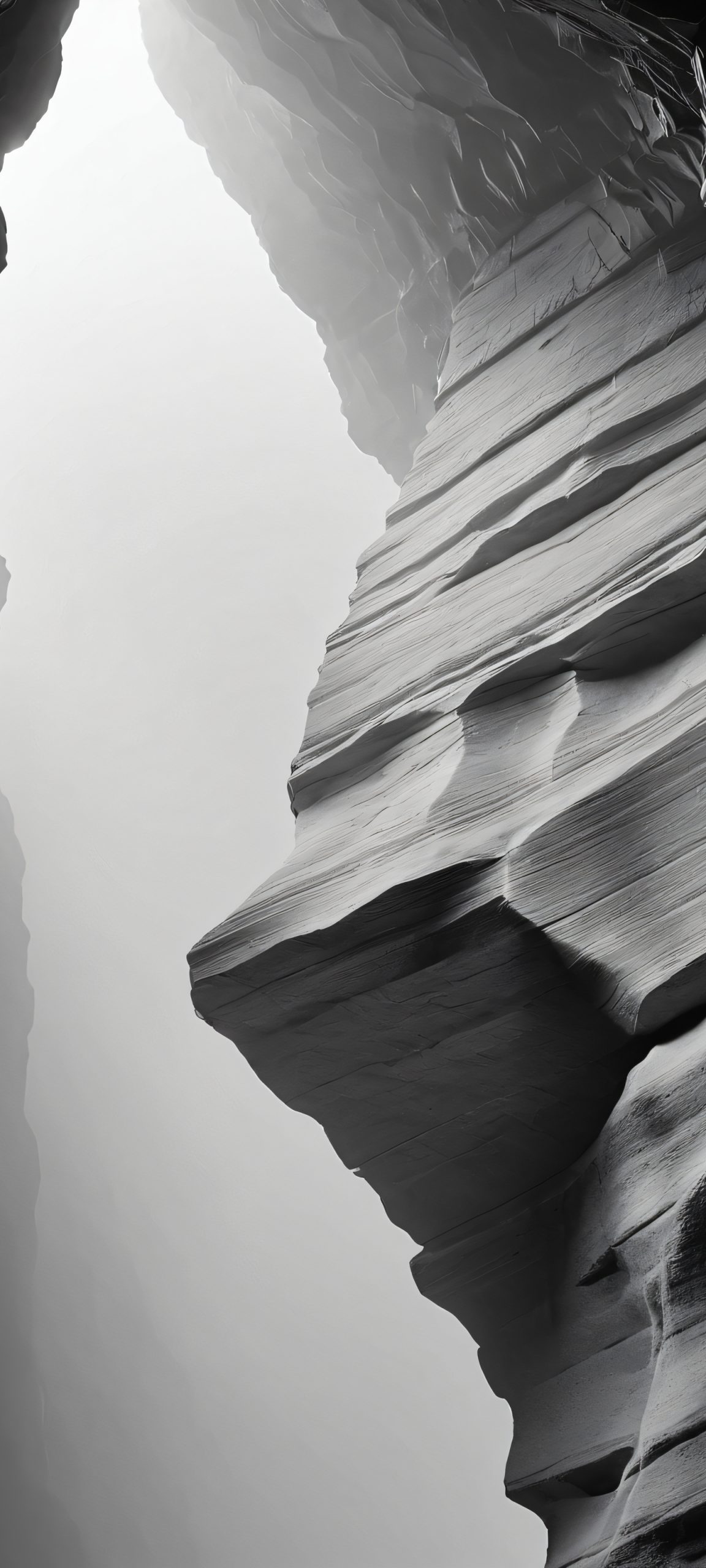 A stunning grayscale image of a stone fragment against a misty cave background, perfectly optimized for iPhone, Samsung Galaxy, and Android home screens.