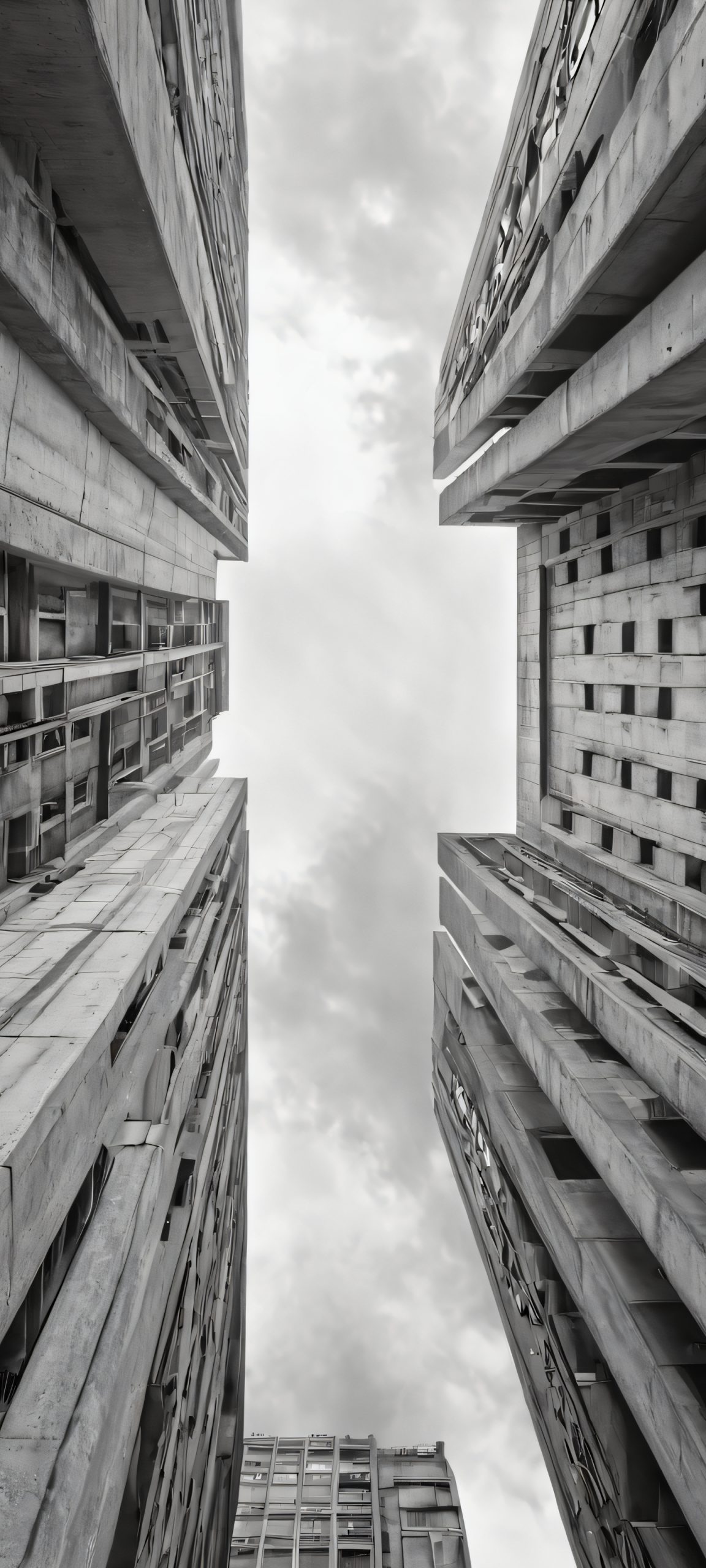 Urban cityscape iPhone and Android wallpaper featuring a gray, overcast sky with black and concrete details. Perfectly optimized for iPhone, Samsung Galaxy, and Android home screens.