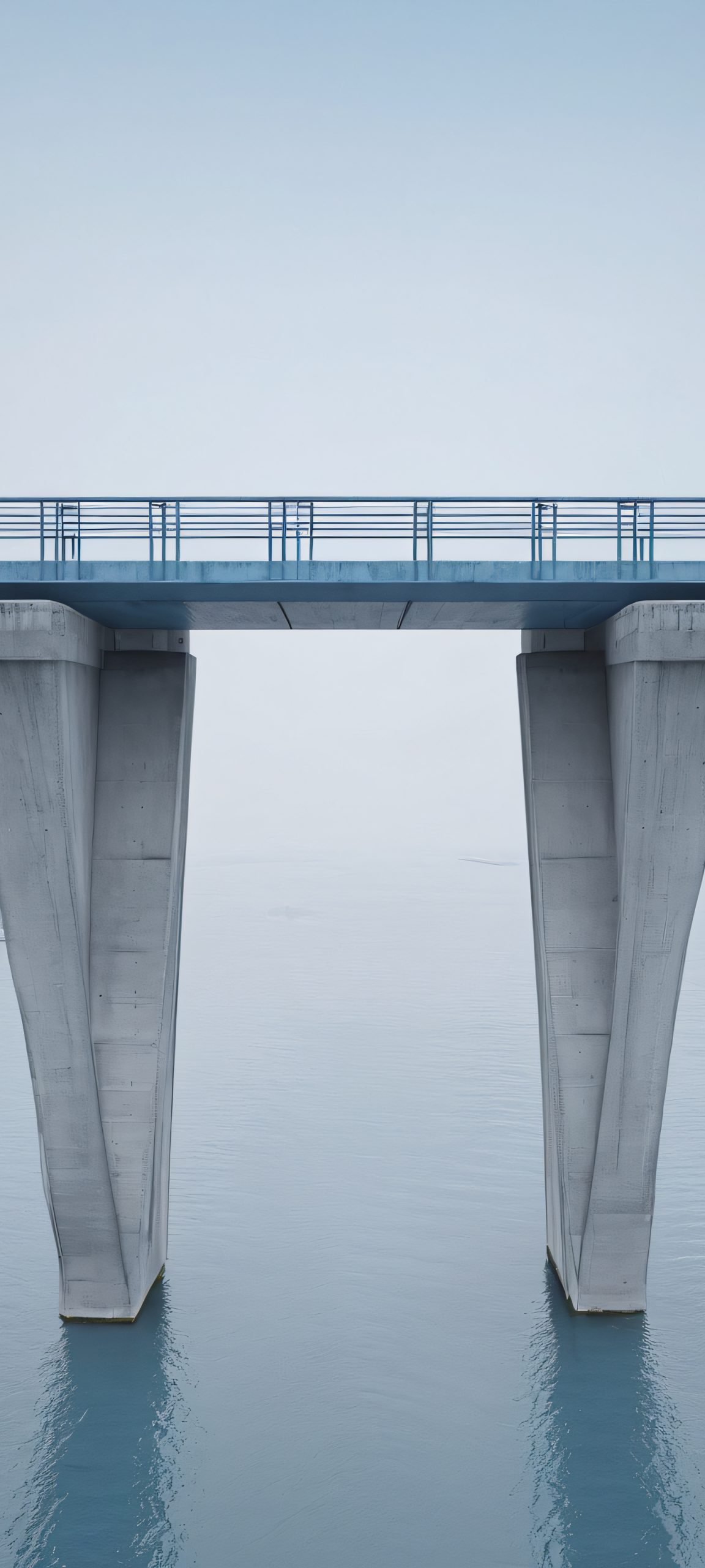 Urban Oasis 2K QHD Mobile Wallpaper A serene urban landscape with concrete bridges against a grey-blue overcast sky, perfect for your iPhone/Android home screen.